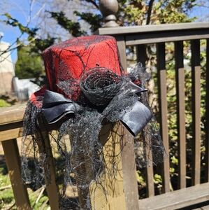 Elegant Red and Black Decorative Hat